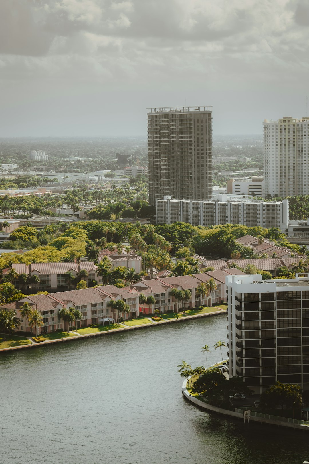 waterfront-buildings-and-lush-green-trees-by-canal-k3j9axis7o
